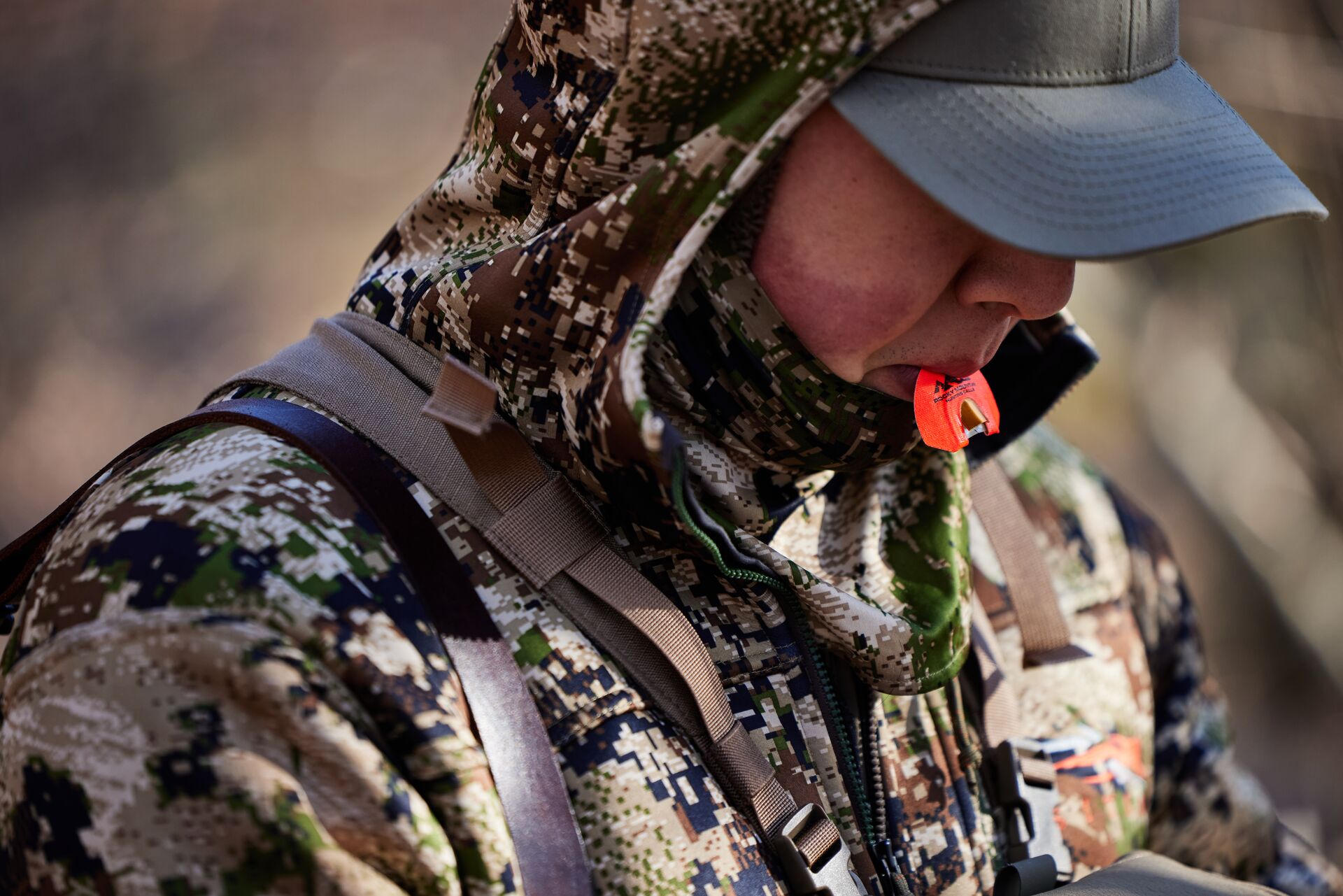 Hunter with turkey call in his mouth. 