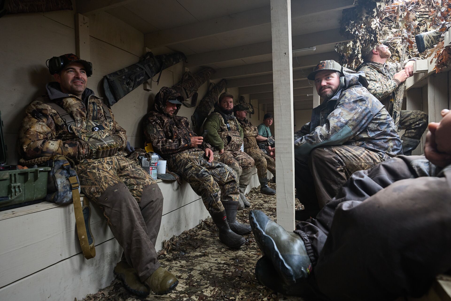 Group of hunters in a duck blind, Maryland apprentice hunting license concept. 