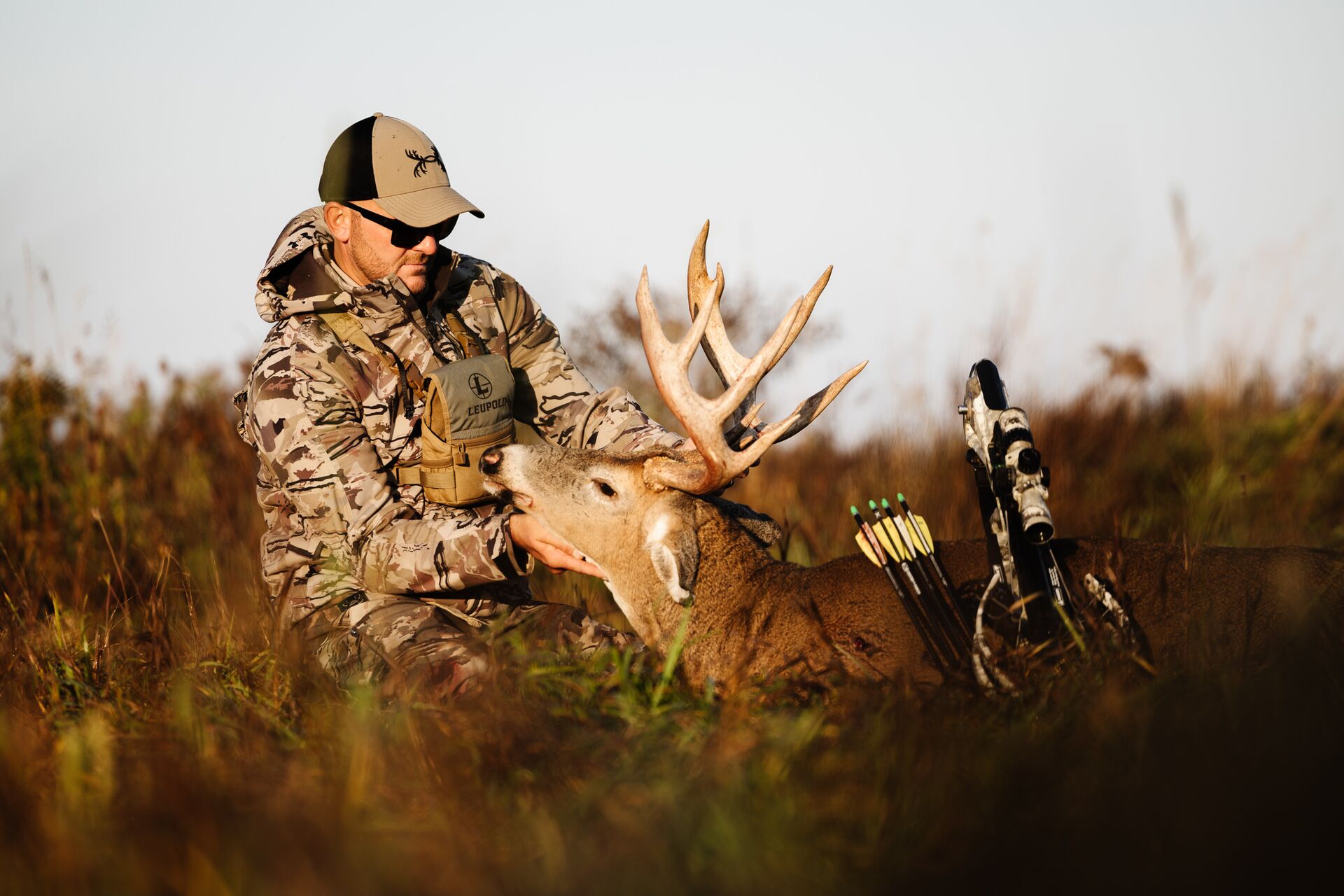 Hunter with buck deer after hunt, do I need hunter education concept.