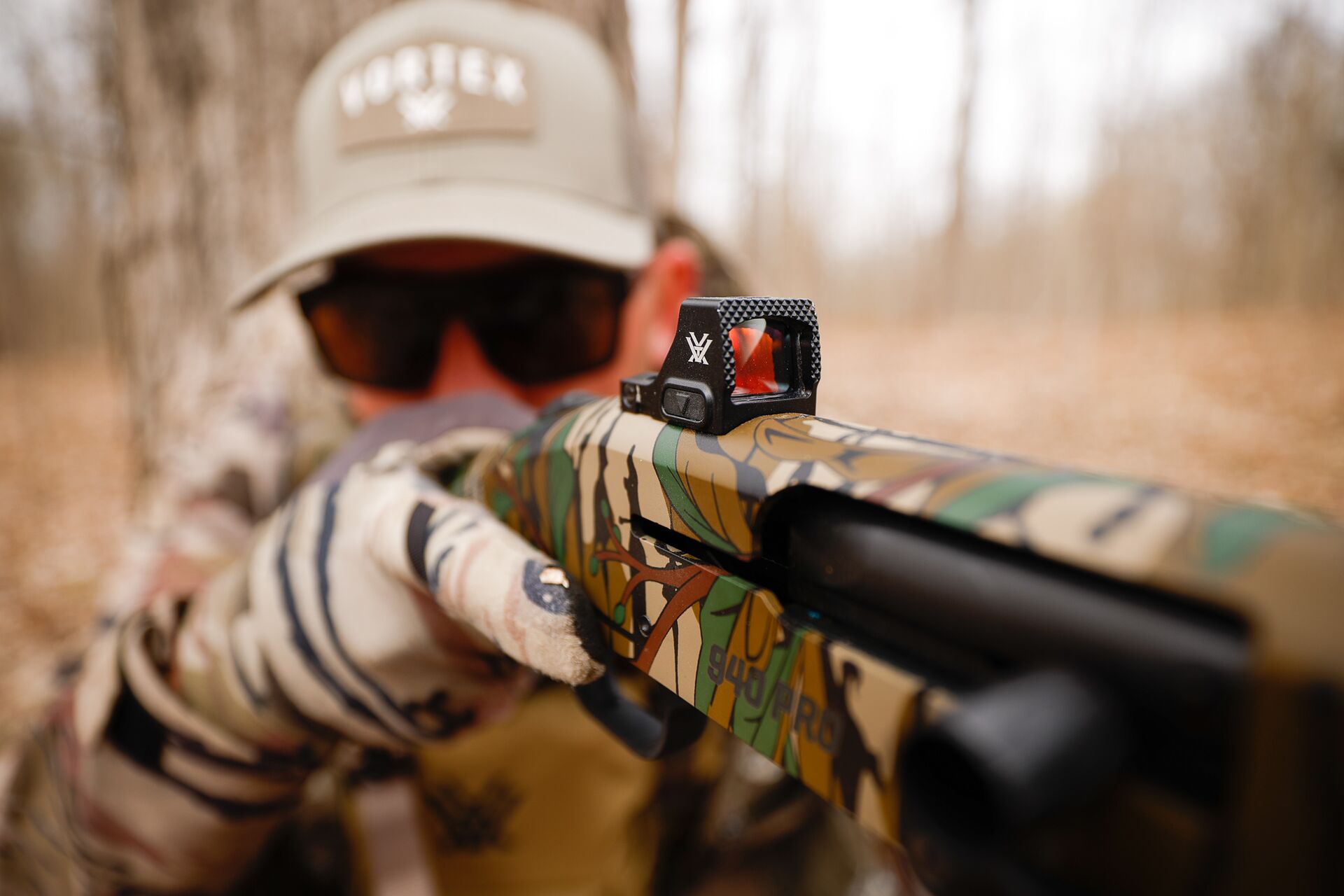 Close-up of a red dot sight on a shotgun, types of shotgun sights concept.