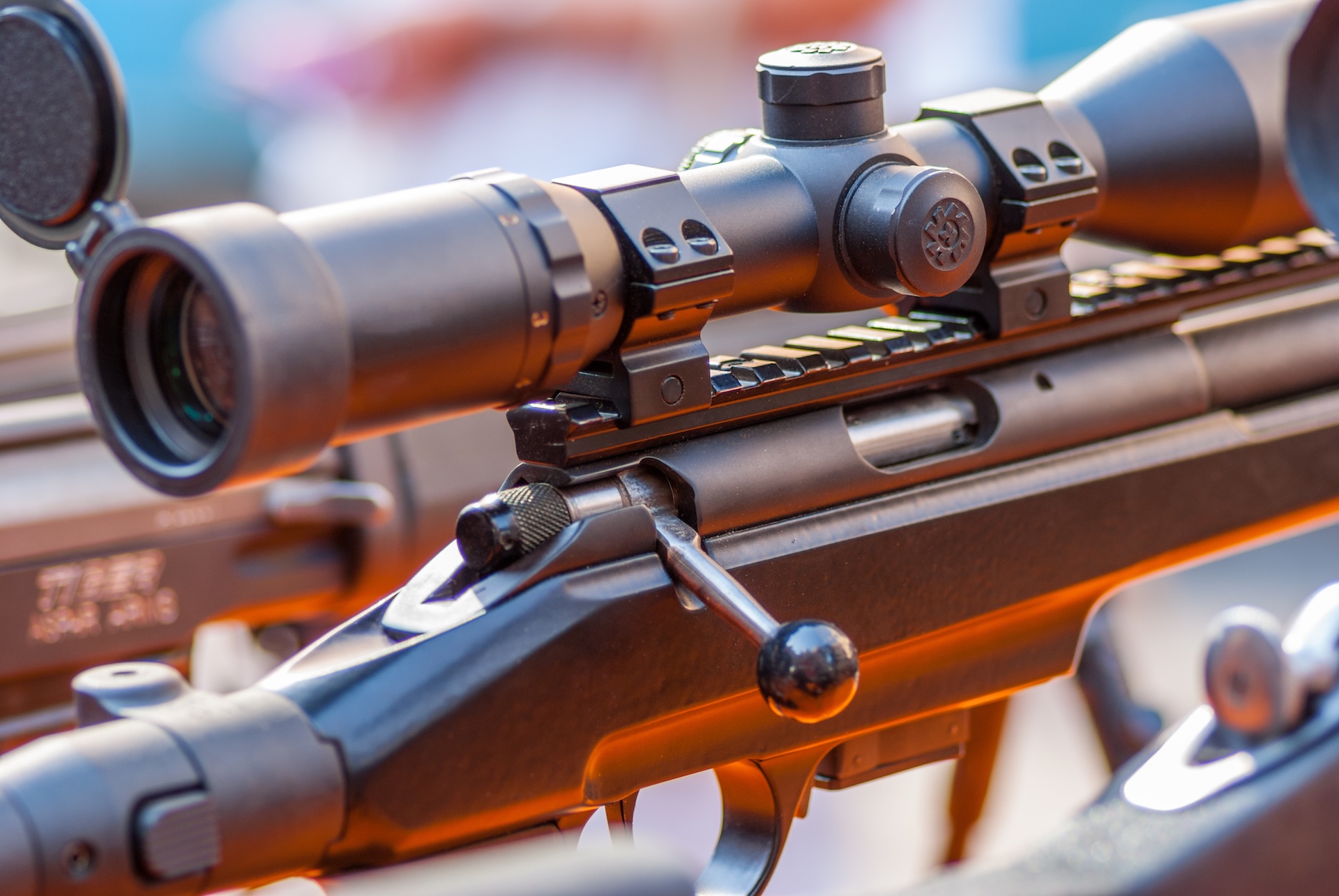Close-up of a scope on a rifle.