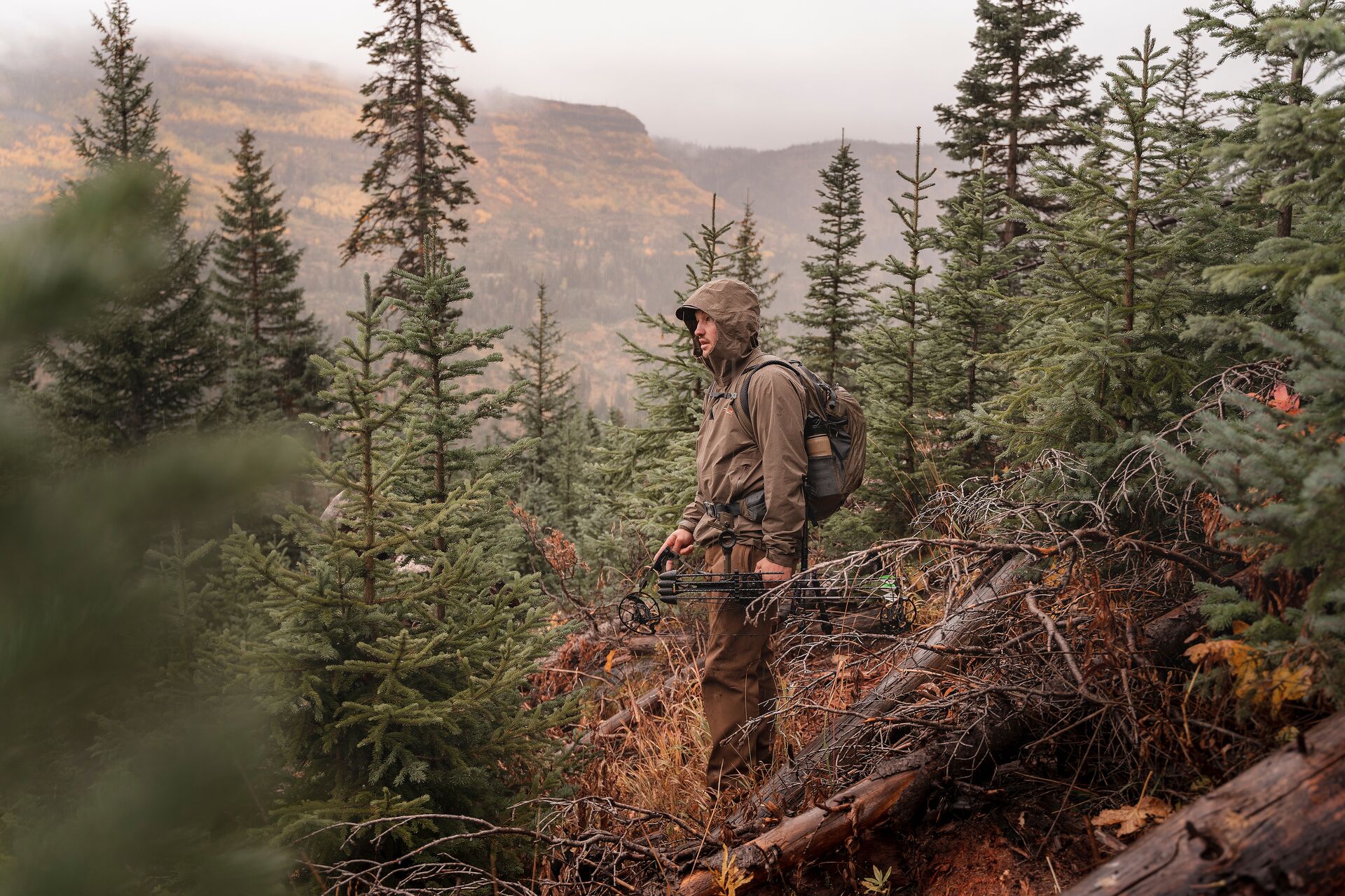 Hunter in the woods on a mountain, outdoor survival concept. 