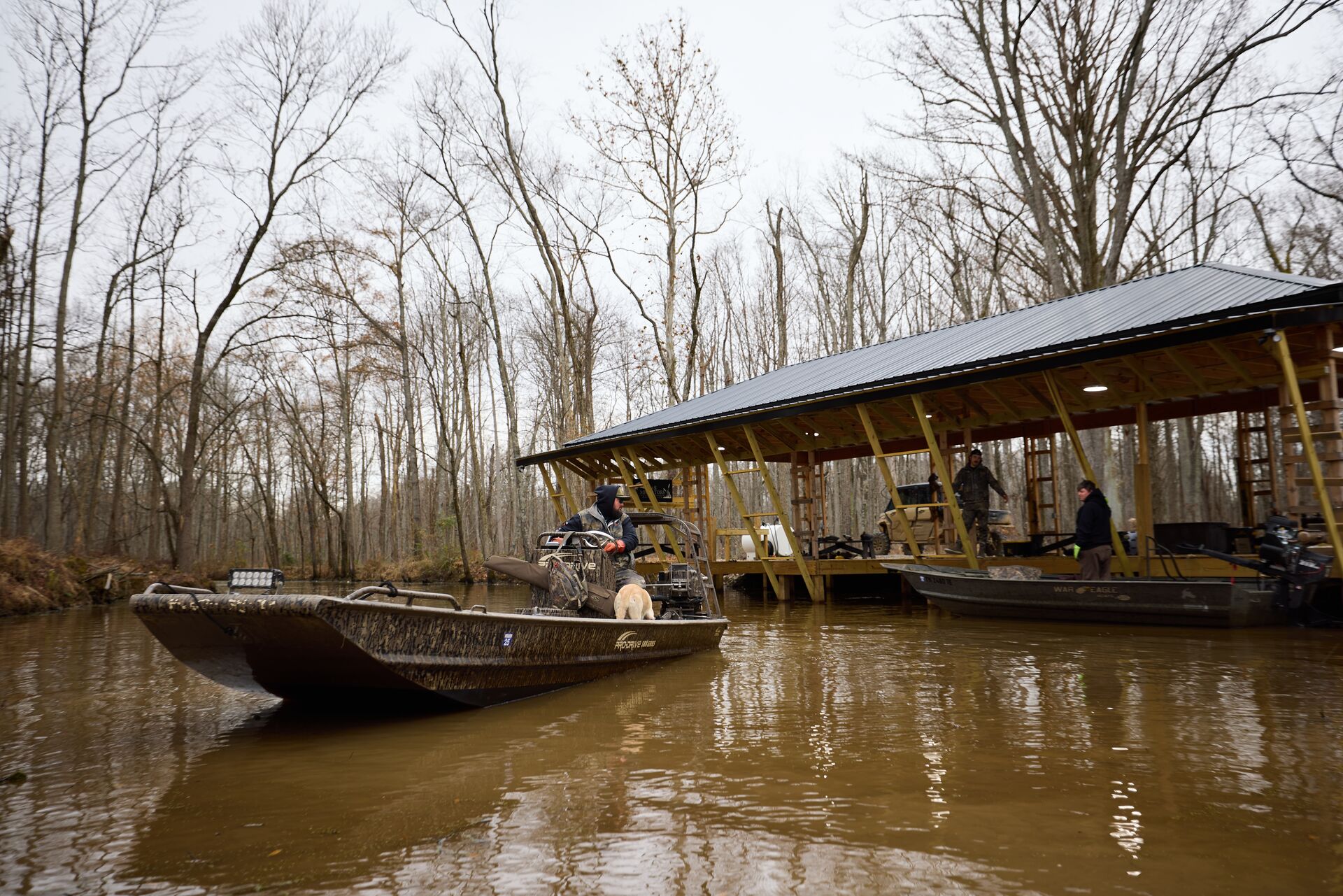 Hunters in boats heading out for waterfowl hunt.