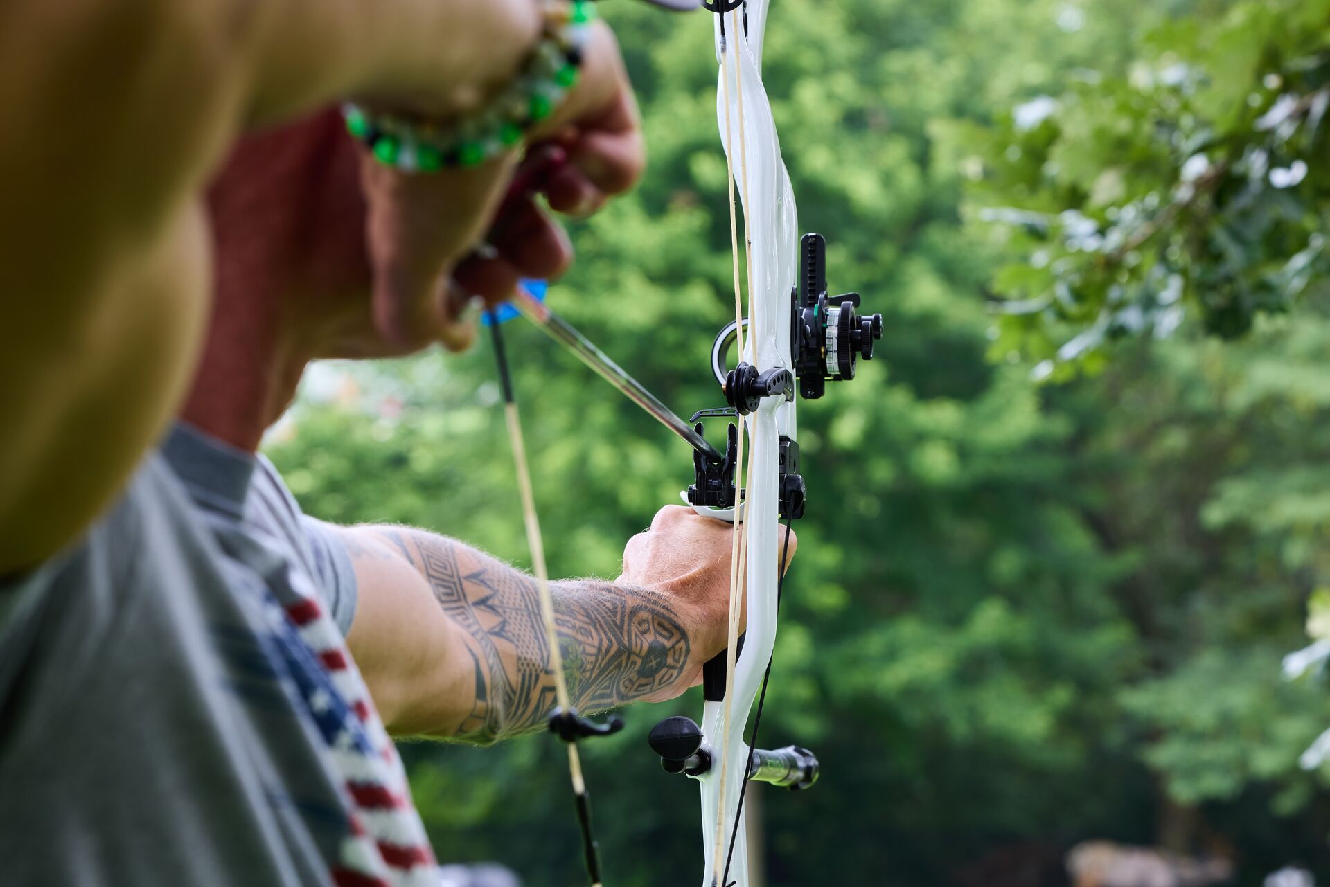 A hunter draws a bow, how to shoot a bow and arrow concept.