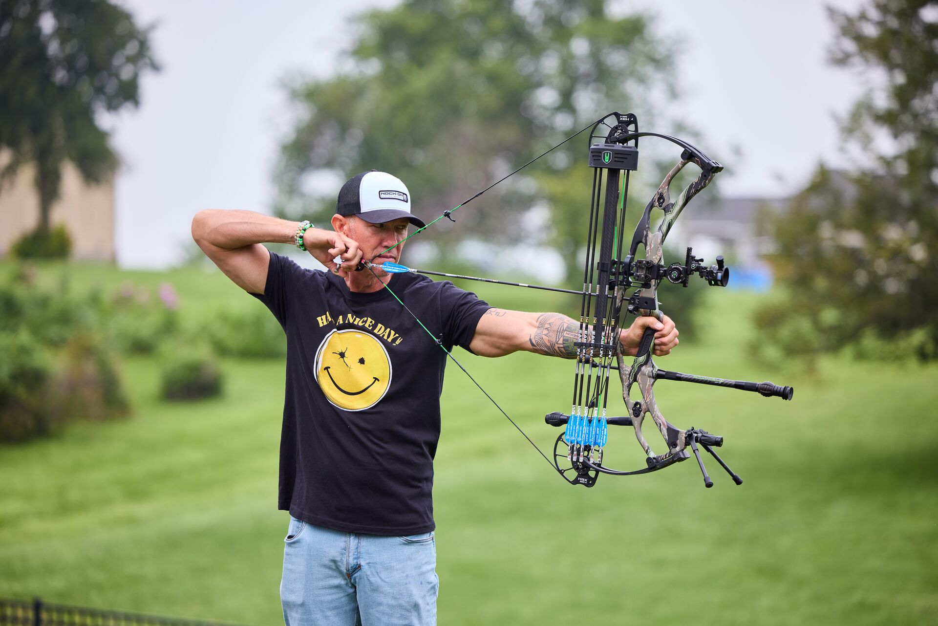John Dudley a hunter draws a compound bow, how to use a bow concept.