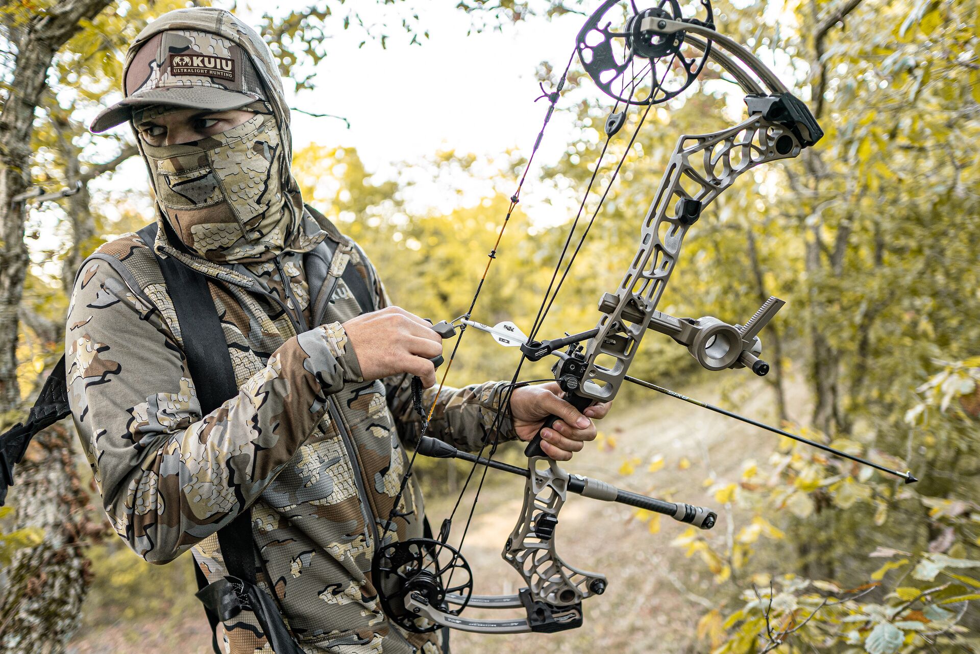 Hunter with compound bow for a hunt.