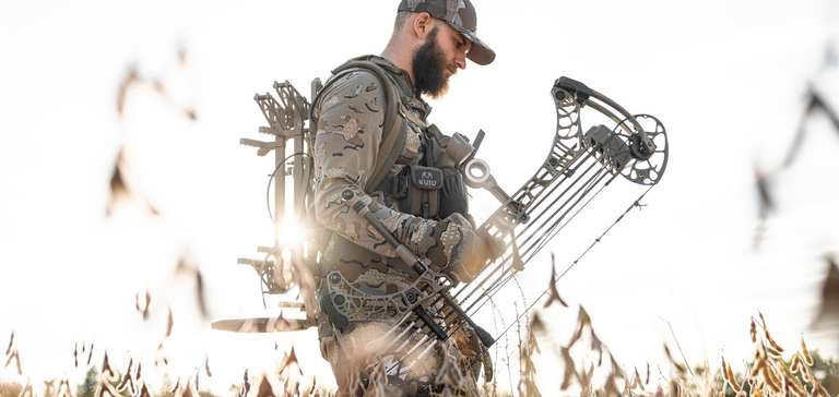 Hunter with a bow, using a bow for elk hunting concept. 