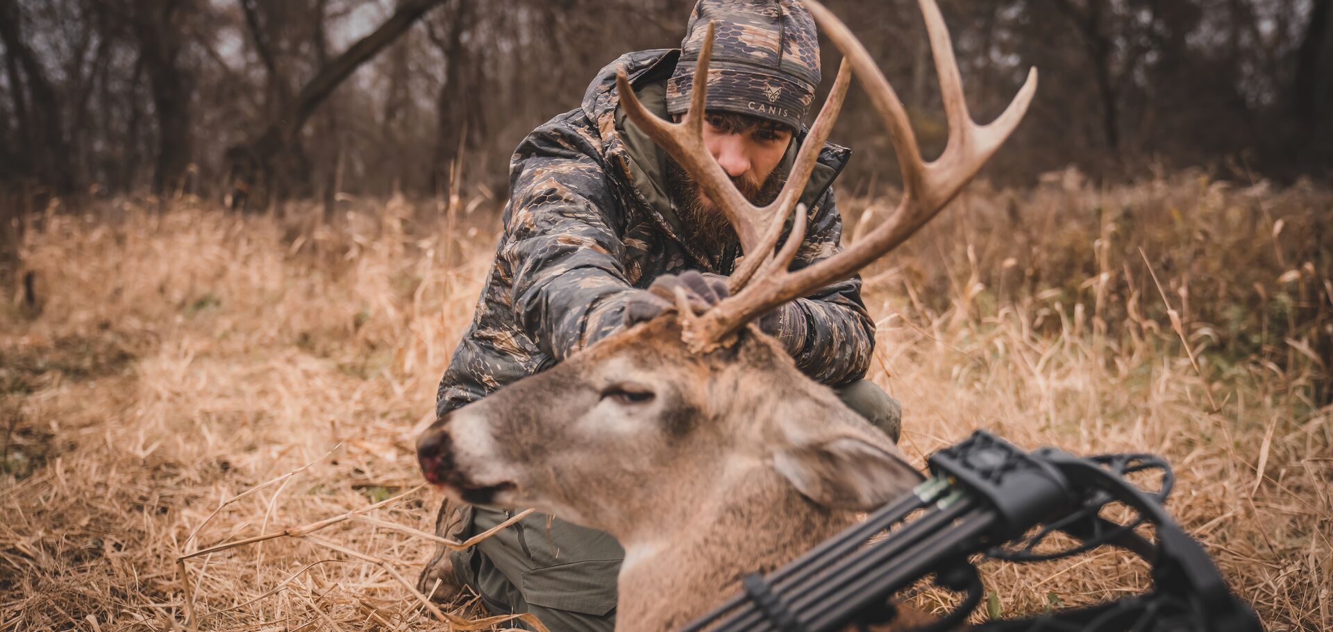 Hunter showing off buck deer after hunt.