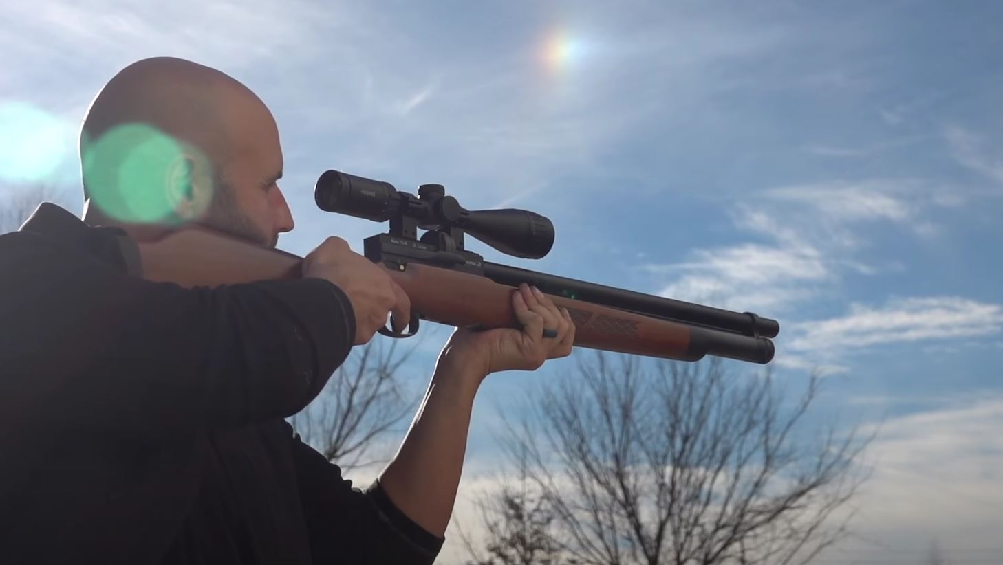 Hunter aims Winchester Big Bore airgun. 